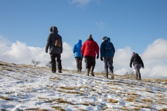 Walkers at Eycott Hill in the snow 