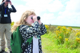 Image of child bird watching at South Walney Nature Reserve