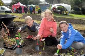 Image of children planting wildflowers at Vulcan Park, Workington