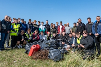 Apprentices from BAE Systems help clean up rubbish on the beaches at South Walney Nature Reserve