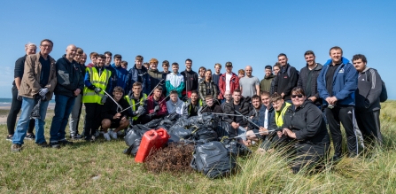 Apprentices from BAE Systems help clean up rubbish on the beaches at South Walney Nature Reserve