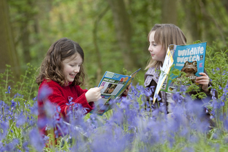 image of Wildlife Watch kids reading magazine - copyright tom marshall