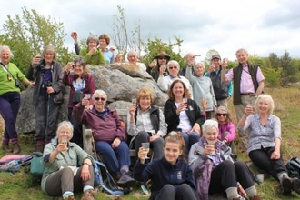 Image of a group of people celebrating with champagne outdoors