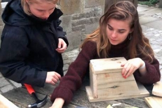 image of Sian Bentley and Grainne Martinwells making bird boxes 