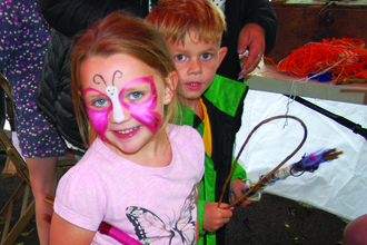 Image of children making willow wands at Get Cumbria Buzzing event in Egremont
