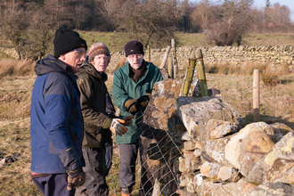 Volunteers top wiring at Eycott Hill Nature Reserve © Ben Wolstencroft