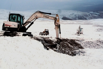 Digger repairing peat in the Lake District