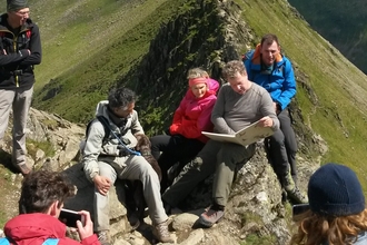 Jamie normington on Helvellyn reading the Lost Words for Cumbria