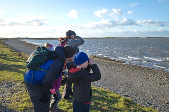 Image of family birdwatching at South Walney Nature Reserve