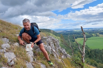 Image of Adam McGinley collecting seeds for seed bank at Gosling Sike credit Cumbria Wildlife Trust