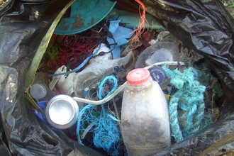 Bin bag full of nasty waste from the beach