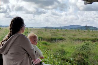 Mother and child at a viewing platform on Foulshaw Moss Nature Reserve