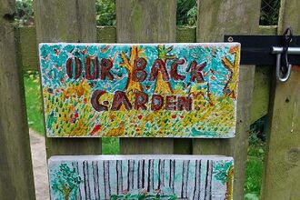 Handmade back garden gate sign