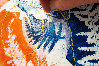 this is a picture of a close up shot of a piece of art created on the Create botanical art with print collage and stitch creative workshop