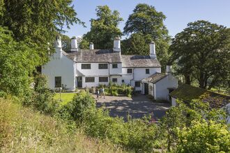 Photo shows Town End, a historic farmhouse from a meadow