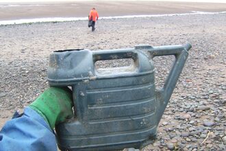 large plastic watering can discovered