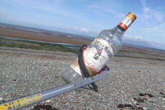 Old glass alcohol bottle
