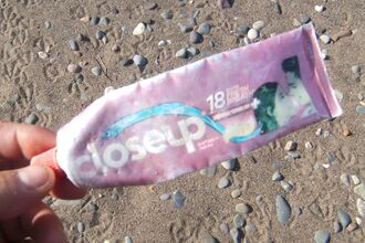 Empty tube of foreign toothpaste