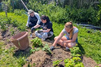 Young people weeding at the Kings Trust
