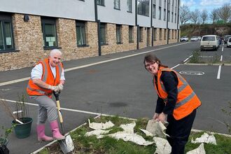 Carlisle Healthcare South - two people creating a space for nature