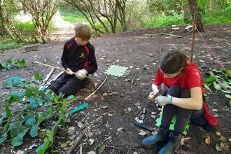 young people learning bushcraft making tools out of wood