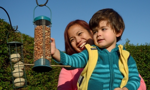 Image of woman and child at bird feed © Nick Upton