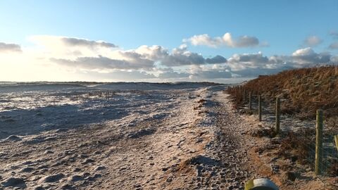 A view of a path along the edge of the beach and dunes at South Walney during frosty weather