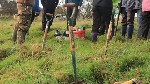 Cold springs community nature reserve - spades and people at an orchard tree planting conservation day