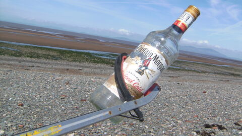 Old glass alcohol bottle