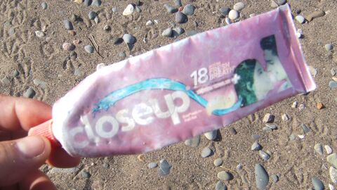 Empty tube of foreign toothpaste