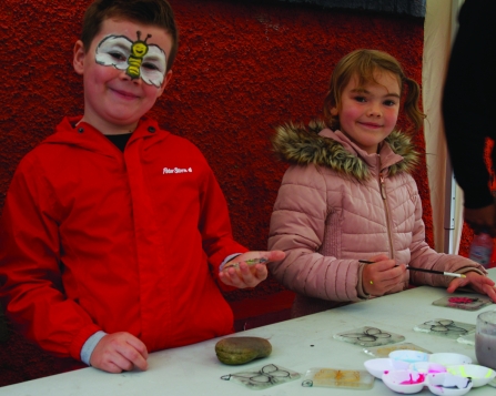 Image of children ceramic painting at Get Cumbria Buzzing event in Egremont