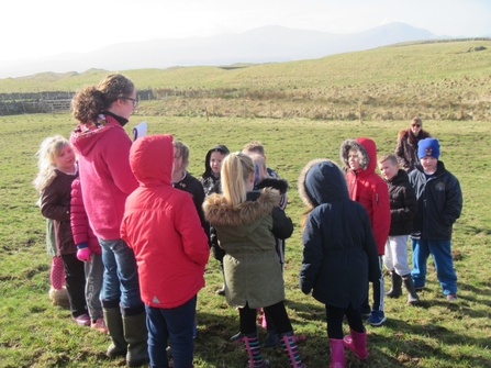 Louise Richards leading a school group at Eycott HiIl