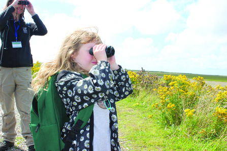 Image of child bird watching at South Walney Nature Reserve