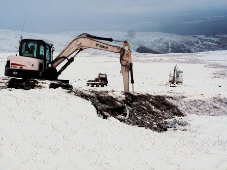 Digger repairing peat in the Lake District