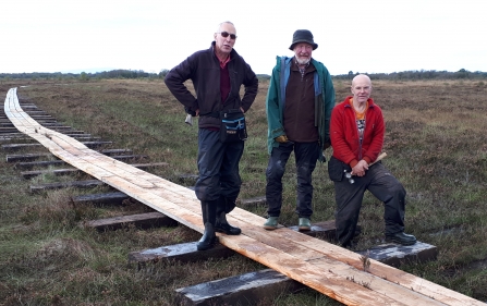 Image of volunteers with new boardwalk at Drumburgh Moss