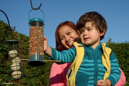 Image of woman and child at bird feed © Nick Upton