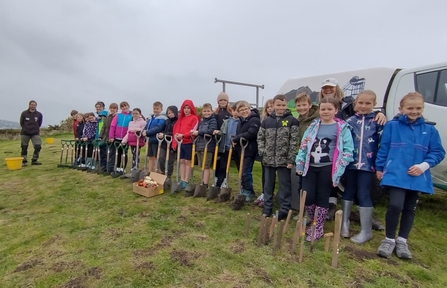 Image of schoolchildren with spades St Bees Village Primary School credit Cumbria Wildlife Trust