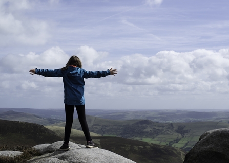 Image of girl on top of mountain