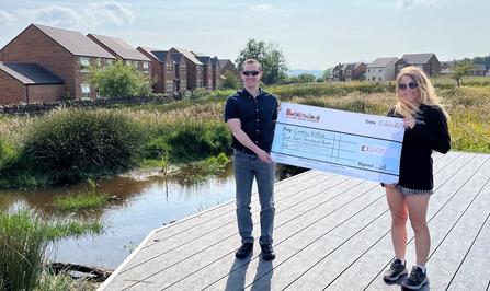 Penrith Town Council present large sized cheque to Ami Stidolph at Cold Springs Nature Reserve