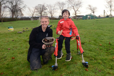 Young woman and child ready to start planting wildflowers at Croftlands, Ulverston