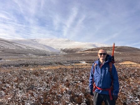 Isaac Johnston with Skiddaw in background, snow on the top