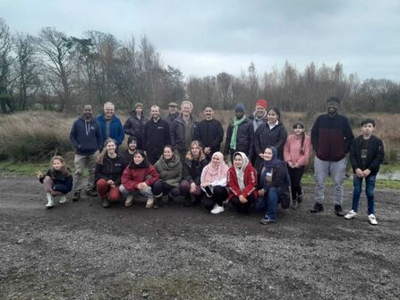 Group of people on an autumn day visiting drumburgh moss