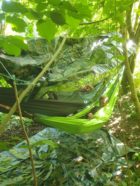 young people using forest school hammocks