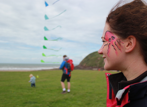 Image of family at beached art event 