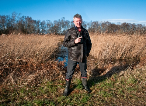 Stephen standing in front of wetland