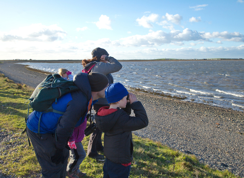 Image of family birdwatching at South Walney Nature Reserve